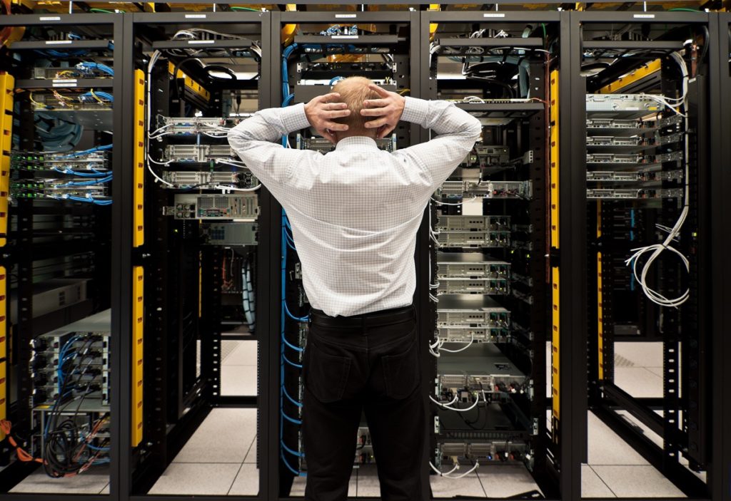Frustrated employee looking at the network server